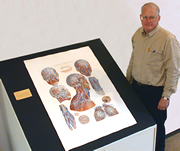 Librarian Ed Holtum with one of the Special Figures plates